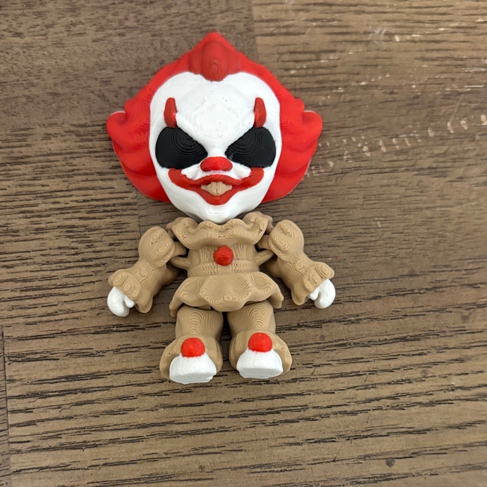 Red and Tan Clown Action Figure